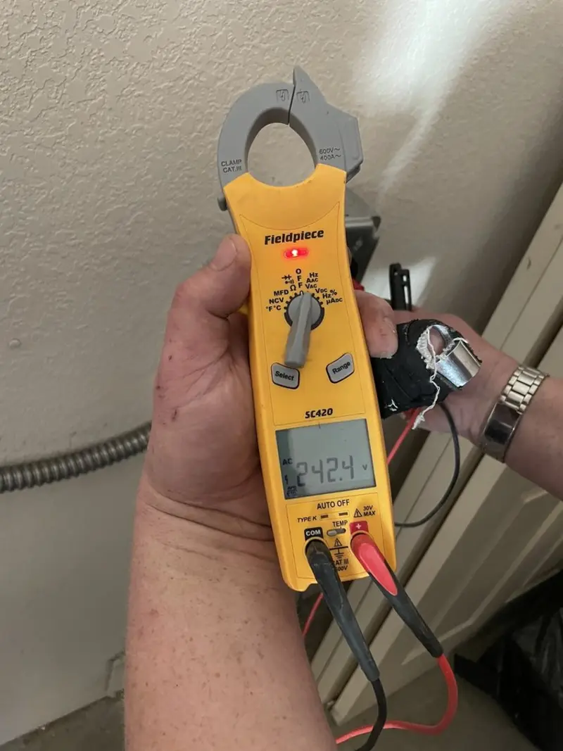 Voltage testing with clamp meter during Recessed Lighting Installation in Pawtucket